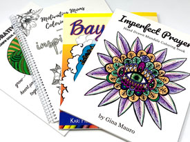 Four coloring books, fanned